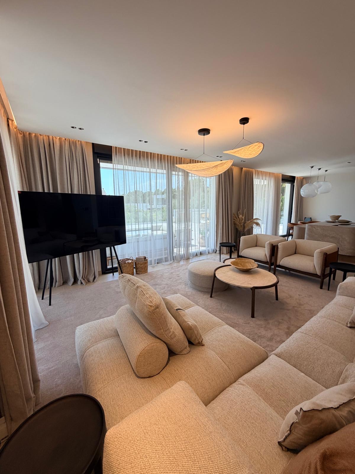 Luxury lounge with sculptural lighting and drapery