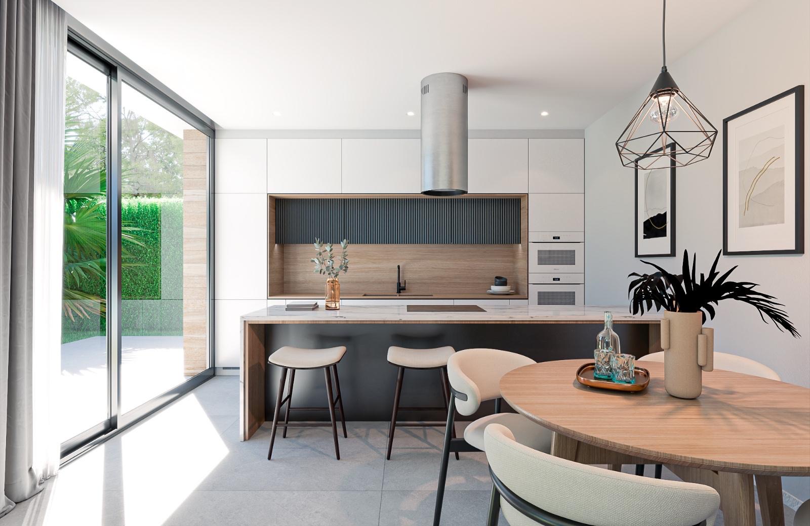Modern open-plan kitchen and dining area with island, garden views and natural light