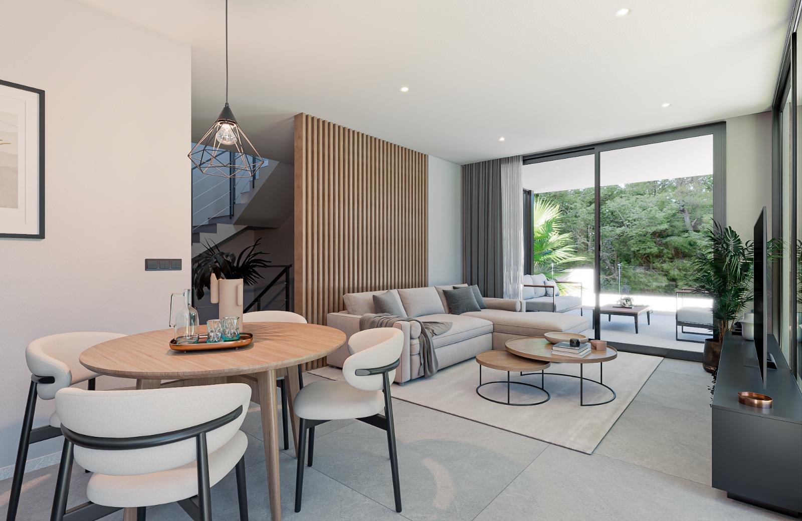 Living-dining room with open staircase to the first floor